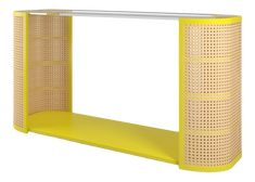 a yellow shelf with perfored design on it