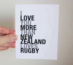 a hand holding up a card that says love you more than new zealand loves rugby