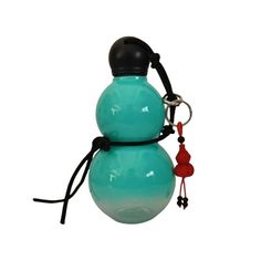 a bottle shaped like a snowman with a keychain on it's neck