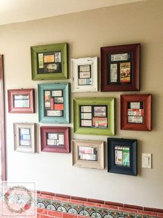 a wall with many different frames on it