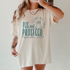 *Sold separately Get ready to party in style with our PJs And Prosecco Bachelorette T-shirt! Whether you're hosting a cozy night in or hitting the town for a night to remember, this shirt is the perfect attire for celebrating the bride-to-be's special occasion. - 100% ring-spun cotton - Medium fabric (6.1 oz/yd² (206.8 g/m - Relaxed fit - Sewn-in twill label CARE INSTRUCTION: 1. Machine wash: cold (max 30C or 90F) 2. Do not bleach 3. Tumble dry: low heat  4. Iron, steam or dry: low heat 5. Do no Prosecco And Pjs Bachelorette, Relaxed Fit Crew Neck Top For Bachelorette Party, Relaxed Fit Cotton T-shirt For Party, Bachelorette Party Pajamas, Spring Crew Neck T-shirt For Bachelorette Party, Pajamas And Prosecco Bachelorette, Party T-shirt With Letter Print In Relaxed Fit, Pjs And Prosecco Bachelorette Party, Bachelorette Tshirt Ideas