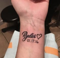 a person with a tattoo on their wrist that says babes 01 17 and has hearts