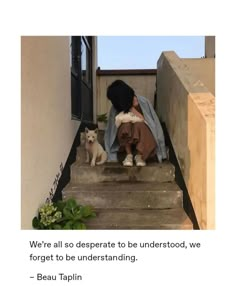 there is a woman sitting on the steps with two dogs next to her and an ad for beau taplin