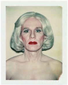 an old photo of a woman with white hair and bright red lipstick on her face