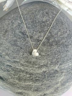 "Beautiful. Delicate. Tiny 8mm Sterling Silver heart bead floats delicately along a Sterling Silver chain. Shown in 17\" length. *If you are unsure of the length you need, or would like to wear this item at different lengths, we now offer an adjustable length option! You can add an adjustable end to your necklace using this link: https://www.etsy.com/listing/791277751/necklace-extension-added-to-your Also available in gold vermeil and found here: https://www.etsy.com/listing/564443983/tiny-gold- Heart Necklace Silver, Tiny Heart Necklace, Sterling Silver Heart Necklace, Sterling Silver Heart Pendant, Necklace For Girlfriend, Necklace Heart, Gold Heart Necklace, Silver Heart Necklace, Sea Glass Necklace