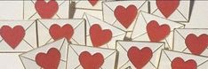 several envelopes with hearts cut out of them are arranged in the shape of a heart