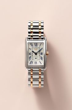 Launched in 1997, the DolceVita collection expresses a contemporary interpretation of watchmaking elegance. The slim rectangular case, a silver flinqué dial, blue steel hands and painted Roman numerals create a refined, feminine aesthetic. Style Name:Longines Dolcevita Bracelet Watch, 20.5mm X 32mm. Style Number: 5462325. Available in stores. Roman Numeral Wrist Watch, Elegant Silver Watch With Square Face, White Gold Watch Accessories With Rectangular Metal Dial, Elegant Rectangular Watch Accessories With Date Display, Rectangular White Gold Watch With Metal Dial, White Gold Rectangular Watch With Metal Dial, Elegant Watches Women, Classic Watch Women, Rectangle Watch