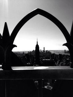 a black and white photo of a city skyline from the top of a building in new york