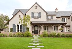 a large house with stone steps leading to the front door