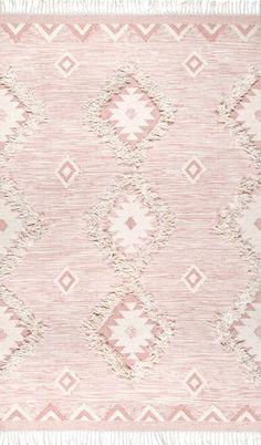 a pink and white rug with fringes on it