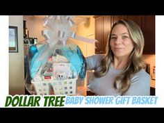 a woman is holding up a doll house in a plastic bag with the words dollar tree by shower gift basket