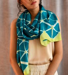 "Blue Womens Silk Shibori Scarf, Hand Dyed in Geometric Tie-Dye Print, Fairtrade Ethical Gift, Perfect I Love You Scarf Gift For Her  Who is it for?  A beautiful Shibori silk scarf gift that features a striking geometric design, handmade in the art of Itajime Shibori. This piece is the perfect scarf gift for women who love luxury gifts, elegant scarves and textiles.  Hand-crafted from pure habutai silk. Clamp-dyed in the art of Itajime Shibori,  this unique print features a striking design in a pretty shade of blue and turquoise and lime. The fabric has a beautiful fluidity and drape, is feather-light and finished with finely rolled hand-stitched edges. The versatile rectangular shape means it can be styled to suit formal looks or to elevate weekend ensembles. Presented in a  luxury white Shibori Scarf, Pattern Scarf Silk, Elegant Scarves, Cerulean Blue, Tie And Dye, Scarf Gift