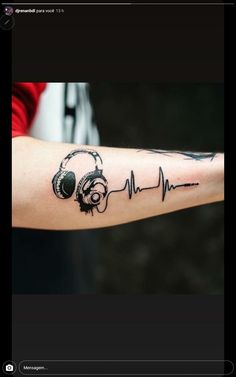 a person with headphones on their arm is shown in this tattoo design by the artist