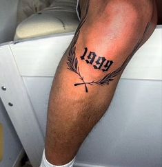 a man with a tattoo on his leg