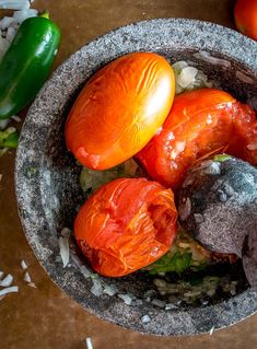 a bowl filled with tomatoes and other vegetables