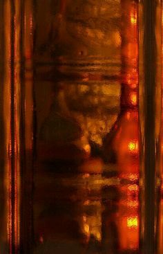 an abstract photograph of bottles in front of a window