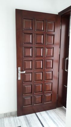 an open door with wooden panels on it