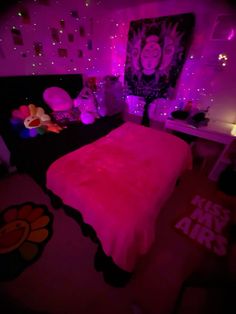 a bed with pink lights in a bedroom next to a painting on the wall and floor