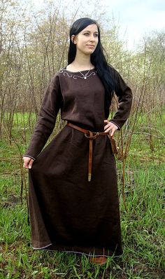 "This early medieval linen dress is universal for the Vikings and Slavs or any others reenactors. Based on medieval iconography and archaeological finds from Europe. Immerse yourself in the world of the Middle Ages with us. A minimalistic dress looks good in any situation, regardless of whether you capture the world with your beloved Viking or wear it in another era. Immerse yourself in the history of medieval fashion. This special dress is decorated with handmade embroidery, made of natural sil Reconstruction Fashion, Medieval Dress Peasant, Slavic Women, Costume Viking, Viking Garb, Medieval Garb, Viking Dress, Viking Costume, Ren Fest