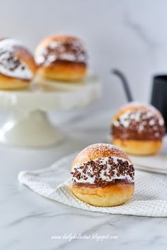 two pastries sitting on top of a white plate