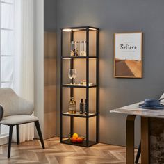 a room with a chair, table and shelves filled with liquor bottles on top of them