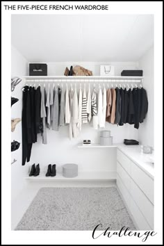 a white closet with clothes and shoes hanging on the wall next to a counter top