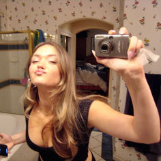 a woman taking a selfie in the bathroom