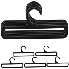 a black and white image of clothes hangers with two clips attached to each one