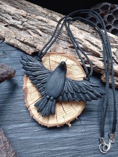 Raven Pendant, Crow Necklace, Celtic Raven Necklace, Big black crow. Black raven with iridescent black feathers. A mystical and enchanting pendant  was made by me manually from professional polymer clay. I will adjust the length of the cord at your request.  This pendant is the only one. It is filled with warmth and made with great love. It is very light, stylish  It will also be a wonderful unusual gift. A gift for bird lovers. In life the product is better than in the picture. Bird Clay, Crow Jewelry, Celtic Raven, Crow Pendant, Crow Necklace, Raven Jewelry, Carved Jewelry, Raven Pendant, Iridescent Black