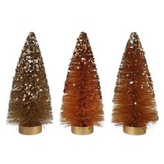 three small christmas trees on gold bases