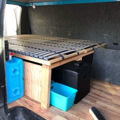 the inside of a van with storage compartments