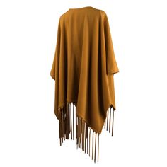 Guaranteed authentic rare Hermes unique vintage shawl/poncho with a dramatic leather fringe. Striking warm gold cashmere and wool large poncho styled shawl. Rich with long, lush leather fringes. The leather is supple, soft and fabulous in the matching color to the cashmere.Two pockets. Utterly amazing piece to live in. Fabric is cashmere and wool.Listing is for the shawl only - Belt not included.LIKE NEWBuy vintage Hermes online at mightychic for superior service and a seamless shopping experien Brown Fringed Poncho For Fall, Brown Fringe Poncho For Fall, Brown Shawl Cape For Fall, Fall Fringe Cape Outerwear, Fringe Cape Outerwear For Fall, Fringe Shawl Outerwear For Fall, Fall Shawl Cape With Fringe, Fringe Shawl Cape For Fall, Fall Fringe Cape Poncho