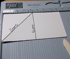 a piece of paper that is on top of a ruler