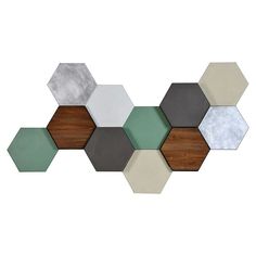 an assortment of hexagonal tiles in various colors and sizes on a white background