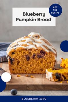 blueberry pumpkin bread with icing on a wooden cutting board next to a slice