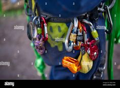 an assortment of locks and shacks attached to the back of a backpack - stock image