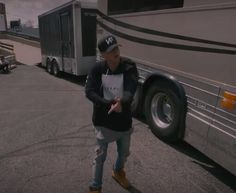 a man standing in front of a bus