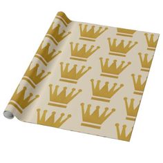 a gold crown pattern on white wrapping paper that is rolled up and ready to be used as a wallpaper