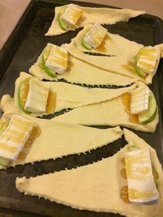 several pieces of food are arranged on a baking sheet to look like they have been cut into triangles