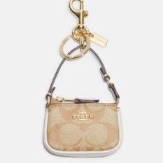 Questions? Leave A Comment Below! Beige Pouch Bag With Gold-tone Hardware, Cream Pouch Bag With Gold-tone Hardware, Coach Gold Bags For On-the-go, Gold Coach Bag With Removable Pouch, Gold Coach Bags For Everyday, Cute Signature, Coach Mini Bag, Signature Canvas, Coach Accessories