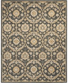 a rug with an ornate design on the front and back side, in grey tones