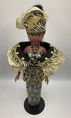 Images of You - Designer Collector Doll Images of You is a 19 1/2 Inch Collector Vinyl Doll, Made Especially for You! The Images of You Doll is dressed in a fashion outfit that embodies exquisite beauty and promotes positive self-defining images of women of color, affirming their boldness and unique sense of style. Although the doll does not identify one particular cultural group, the designs represent cultural pride, elegance and sophistication. The Images of You Doll comes with a dress made wi African American Art Dolls, African Dolls Newspaper, Black Dolls Vintage, Ivorian Doll, African Barbie Dolls, Doll Images, African Dolls, African American Dolls, Fashion Hijab