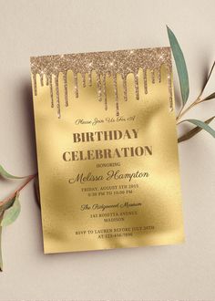 a gold foil birthday party card on top of a table