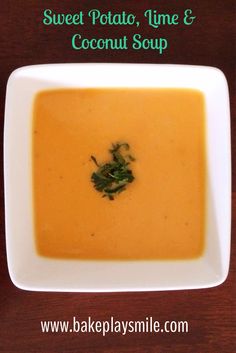 a white bowl filled with soup on top of a wooden table