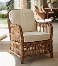 a wicker chair sitting on top of a patio