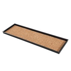 a black tray with a brown mat on it