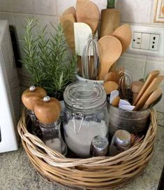 a basket filled with lots of kitchen utensils