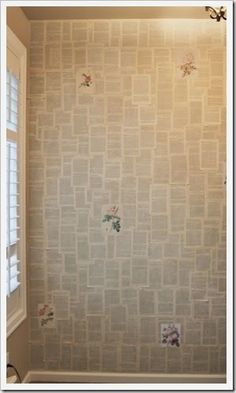 an empty bathroom with floral wallpaper on the walls and window in the shower stall