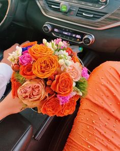 a bouquet of flowers is sitting in the driver's seat