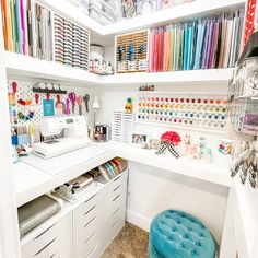 a sewing room with lots of crafting supplies